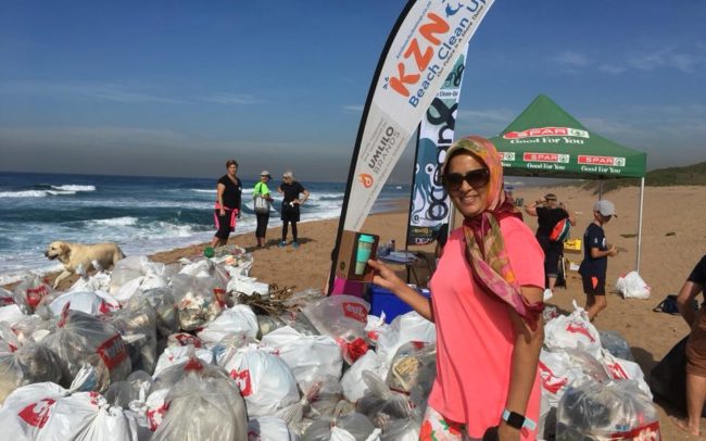 Loyal KZN Beach Clean Up volunteer Aneesa Pandor with a reusable bamboo ecoffee cup.