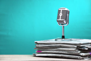microphone and newspapers