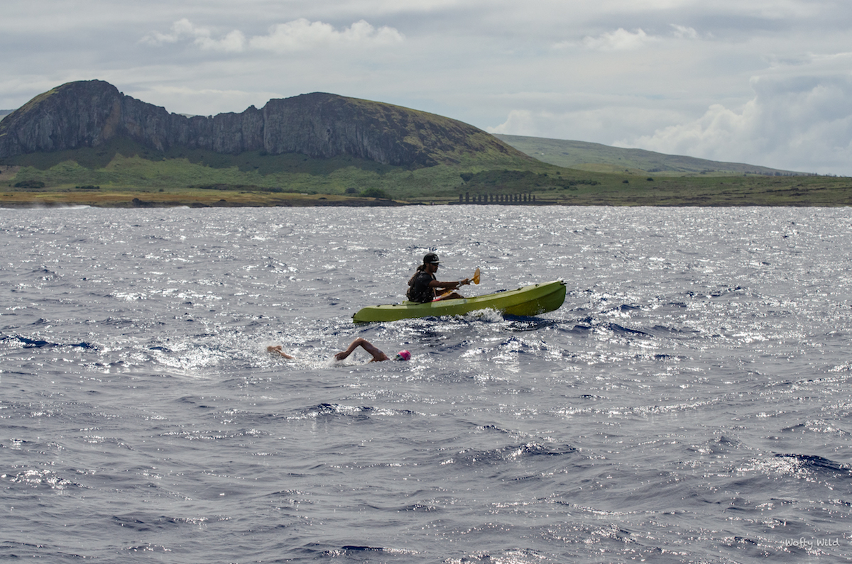 Sarah Ferguson swimming past Easter Island's Moai statues of Tongariki.