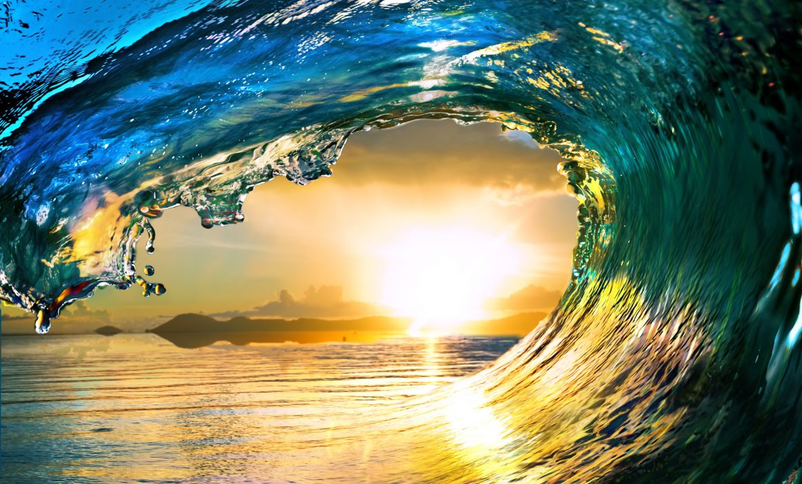 World Oceans Day: An Ocean Wave at Sunset