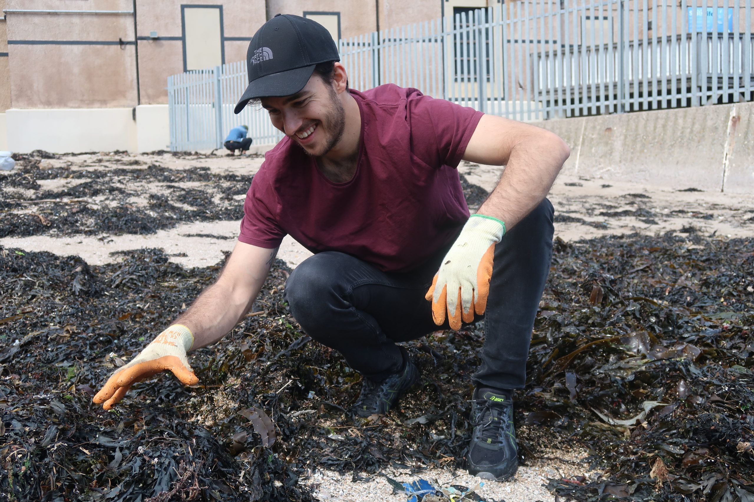 Juan Castano in action at a beach cleanup.