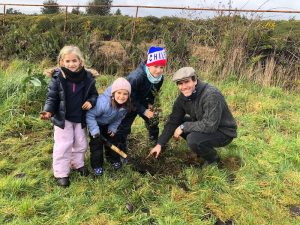 Tree planting family on